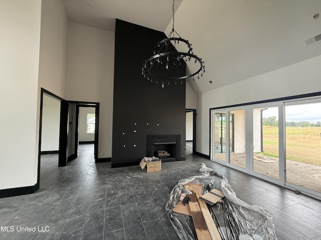 living room featuring high vaulted ceiling, healthy amount of natural light, baseboards, and a fireplace