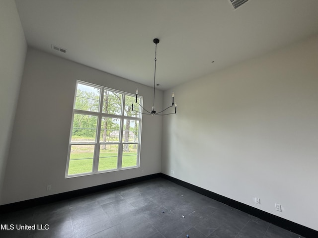 unfurnished dining area with baseboards