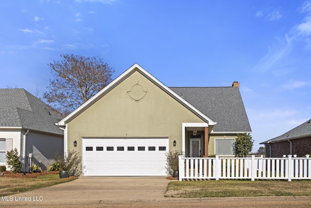 view of front of property with a garage