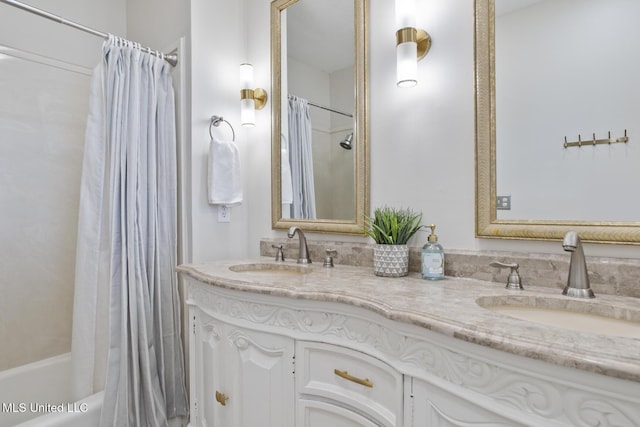 bathroom with shower / tub combo and vanity