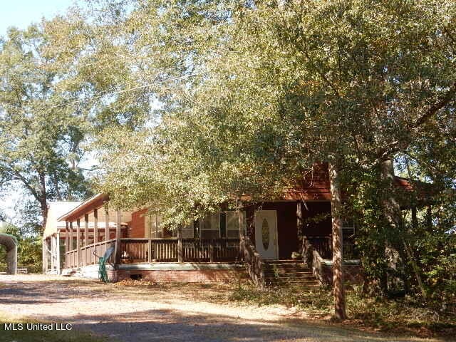 view of front of home with a wooden deck