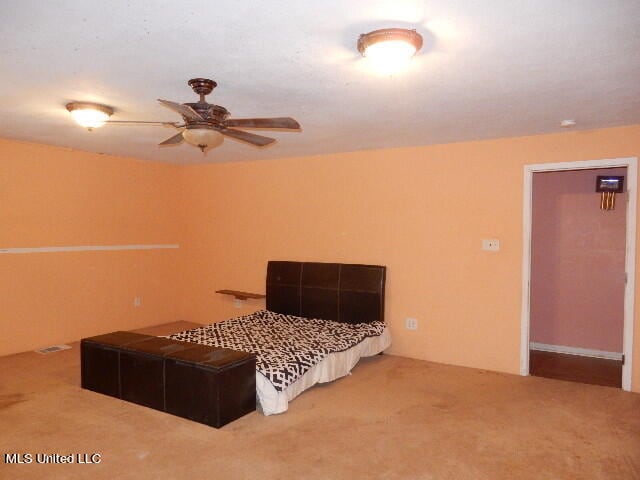 carpeted bedroom featuring ceiling fan