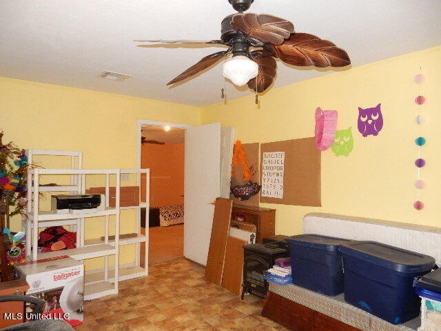 interior space featuring ceiling fan