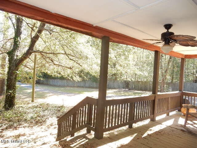 wooden deck with ceiling fan