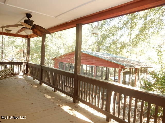 wooden deck with ceiling fan