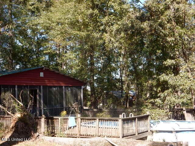 view of swimming pool with a sunroom