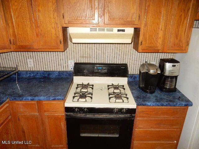 kitchen with white range with gas cooktop