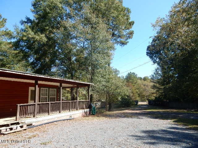 view of yard with covered porch