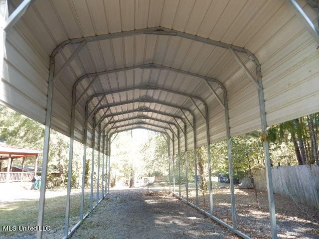 view of parking / parking lot with a carport