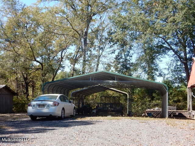 view of parking featuring a carport