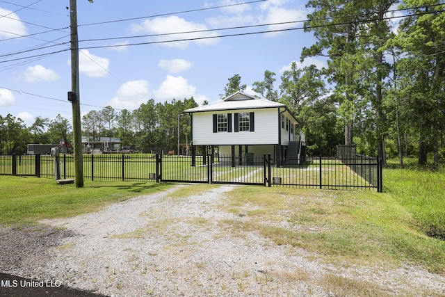 5061 1st Ave, Bay Saint Louis, MS 39520 - coastal inspired home with driveway and metal roof