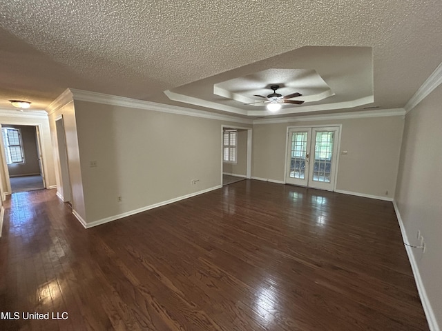 1171 S Bayou Rd, Boyle, MS 38730 - unfurnished room with ceiling fan, a raised ceiling, dark wood-style flooring, crown molding, and a textured ceiling