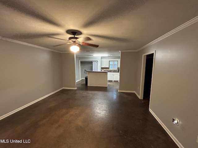 1171 S Bayou Rd, Boyle, MS 38730 - unfurnished living room with ceiling fan, a textured ceiling, crown molding, and concrete floors