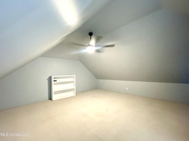 bonus room with carpet flooring, ceiling fan, and vaulted ceiling