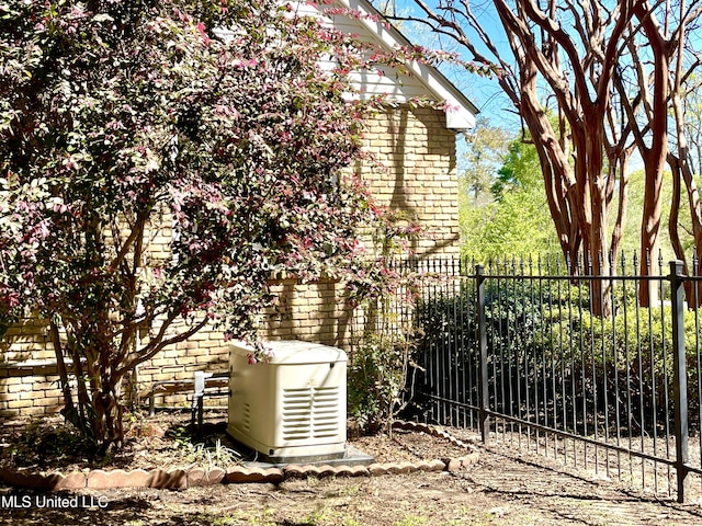 view of side of property with fence