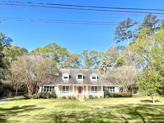 cape cod home with a porch and a front lawn