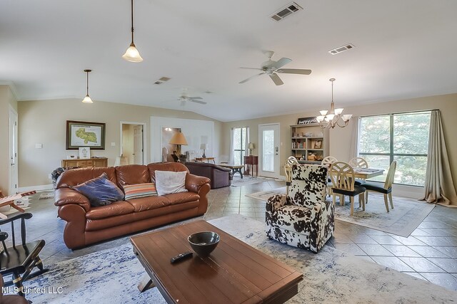 146 Maple Dr, Perkinston, MS 39573 - tiled living area with lofted ceiling, baseboards, a chandelier, and a ceiling fan