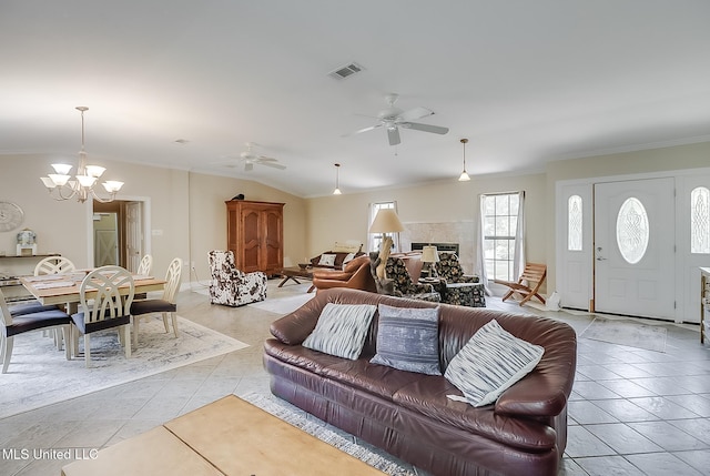 146 Maple Dr, Perkinston, MS 39573 - living room featuring a chandelier, ornamental molding, light tile patterned floors, a ceiling fan, and vaulted ceiling