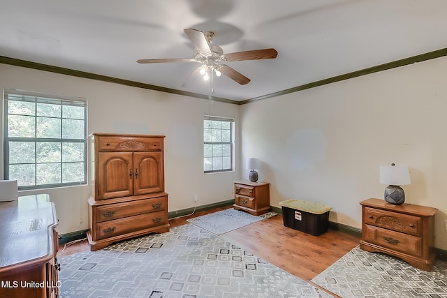 146 Maple Dr, Perkinston, MS 39573 - bedroom with crown molding, wood finished floors, baseboards, and ceiling fan