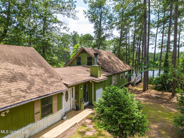 146 Maple Dr, Perkinston, MS 39573 - view of front facade with roof with shingles and a water view
