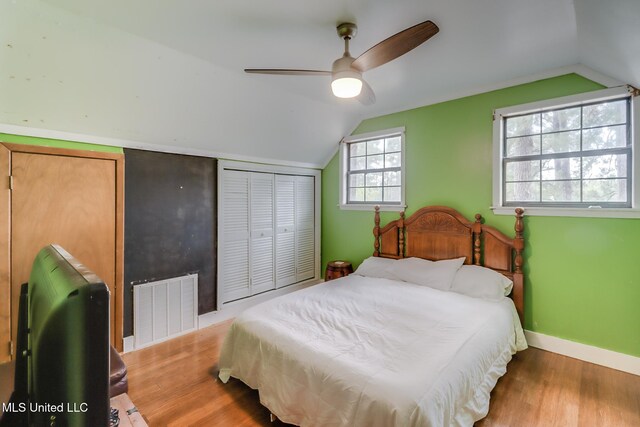 146 Maple Dr, Perkinston, MS 39573 - bedroom with vaulted ceiling, wood finished floors, baseboards, a closet, and a ceiling fan