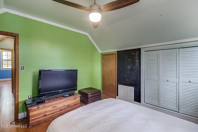 146 Maple Dr, Perkinston, MS 39573 - bedroom featuring lofted ceiling, baseboards, wood finished floors, a closet, and a ceiling fan