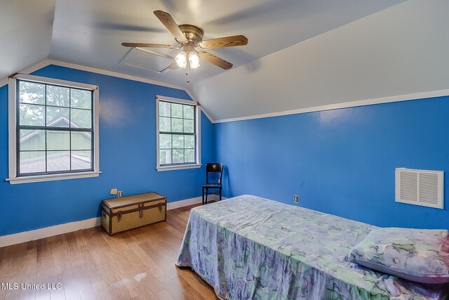 146 Maple Dr, Perkinston, MS 39573 - bedroom with lofted ceiling, baseboards, wood finished floors, and a ceiling fan