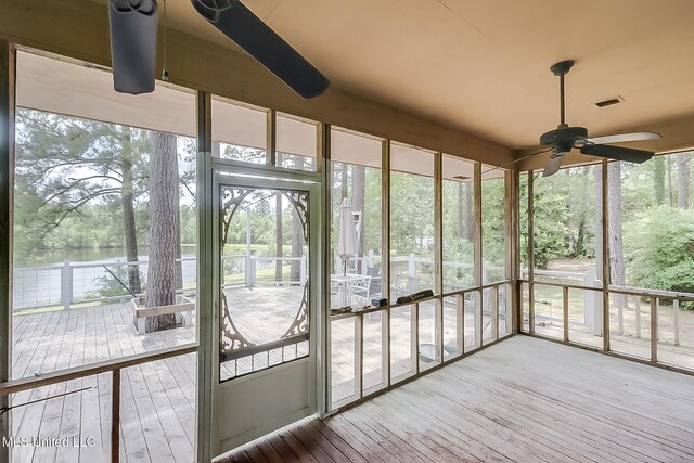 146 Maple Dr, Perkinston, MS 39573 - unfurnished sunroom featuring ceiling fan and a water view