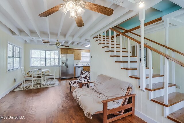 146 Maple Dr, Perkinston, MS 39573 - stairs featuring a ceiling fan, wood finished floors, beam ceiling, and baseboards