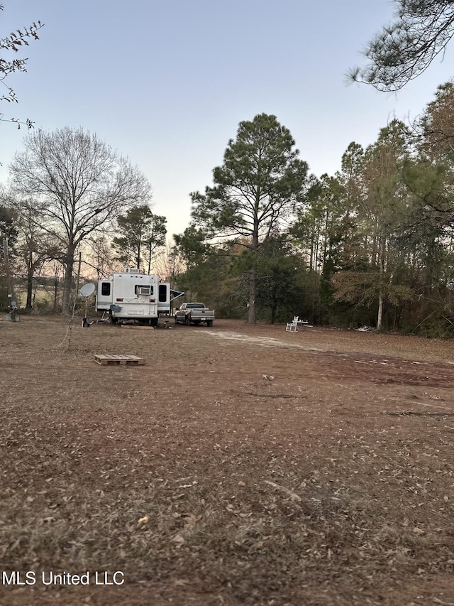 view of yard at dusk