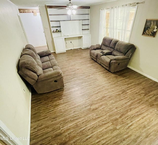 111 Brookfield Dr, Natchez, MS 39120 - living room with wood finished floors, baseboards, and a ceiling fan