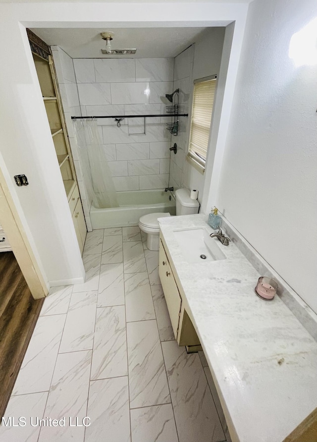 111 Brookfield Dr, Natchez, MS 39120 - full bath with marble look tiles, toilet, shower / bath combination, vanity, and baseboards