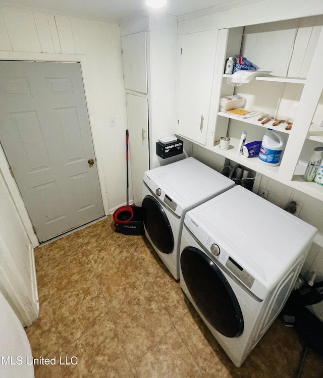 111 Brookfield Dr, Natchez, MS 39120 - washroom featuring washing machine and dryer, light floors, and cabinet space