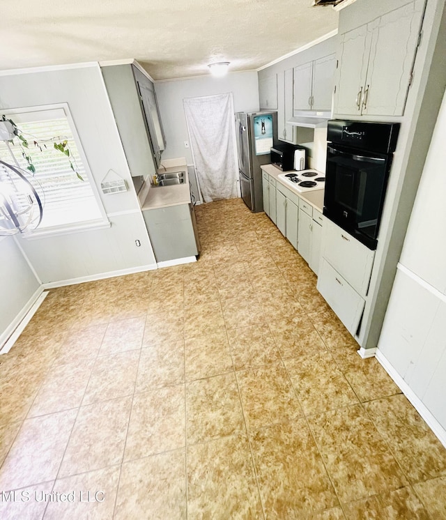 111 Brookfield Dr, Natchez, MS 39120 - kitchen featuring black oven, crown molding, light countertops, a sink, and under cabinet range hood