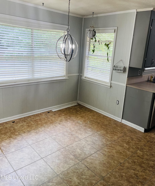 111 Brookfield Dr, Natchez, MS 39120 - unfurnished dining area featuring a chandelier, ornamental molding, baseboards, and wooden walls