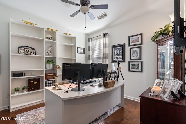 office area with dark wood-type flooring and ceiling fan