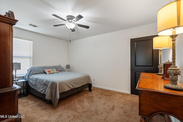 bedroom with light colored carpet and ceiling fan