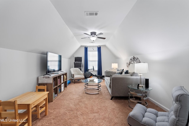 carpeted living room featuring vaulted ceiling and ceiling fan