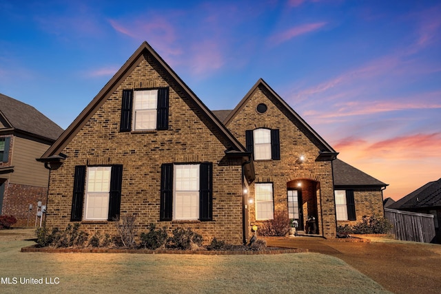 view of front of home with a yard