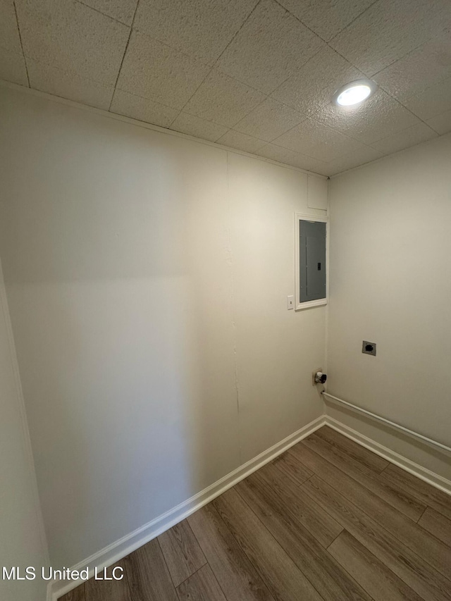 clothes washing area featuring laundry area, electric panel, dark wood finished floors, and electric dryer hookup