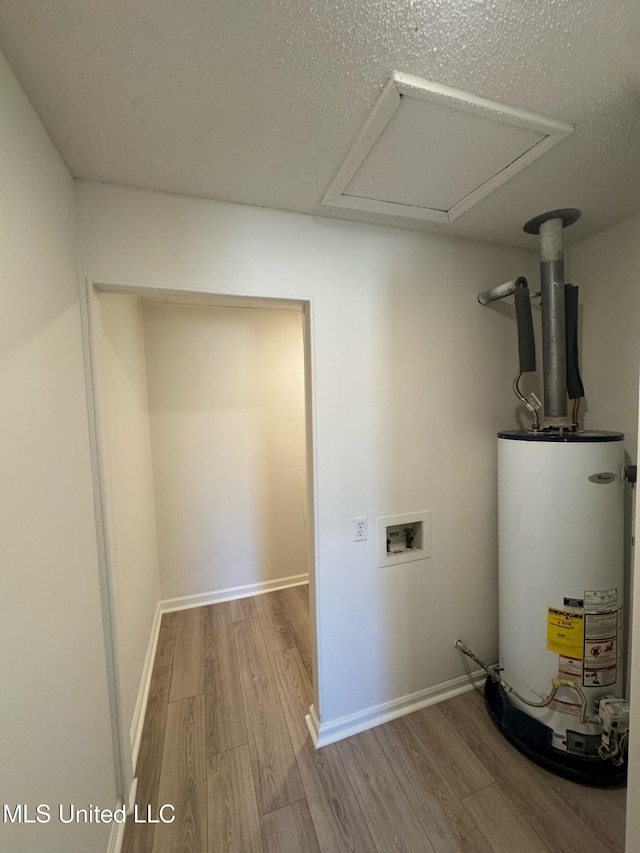 utility room with water heater