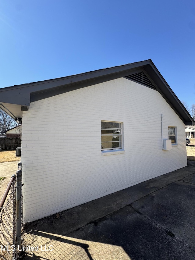 view of home's exterior with brick siding