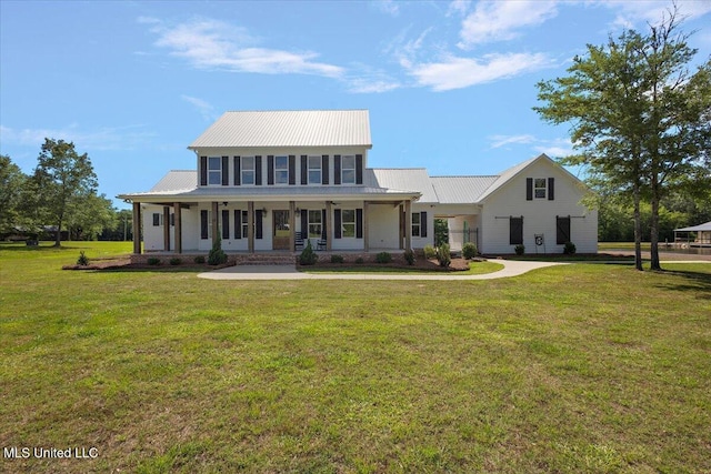1254 Wade Patrick Rd, Brandon, MS 39042 - view of front of property featuring a front lawn, metal roof, and a porch