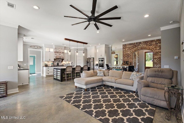 1254 Wade Patrick Rd, Brandon, MS 39042 - living room featuring a ceiling fan, ornamental molding, recessed lighting, finished concrete flooring, and baseboards