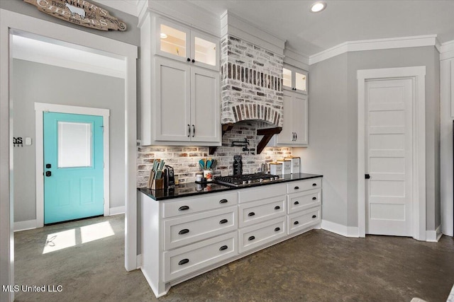 1254 Wade Patrick Rd, Brandon, MS 39042 - kitchen featuring dark countertops, concrete floors, decorative backsplash, baseboards, and white cabinetry