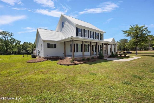 1254 Wade Patrick Rd, Brandon, MS 39042 - view of front of home with a front lawn, central AC, metal roof, and a porch