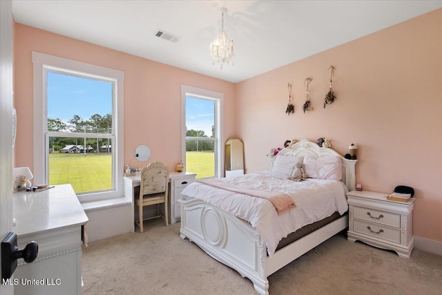 1254 Wade Patrick Rd, Brandon, MS 39042 - bedroom featuring a chandelier and light carpet