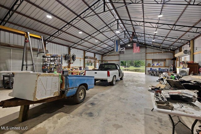 1254 Wade Patrick Rd, Brandon, MS 39042 - garage with a workshop area and metal wall