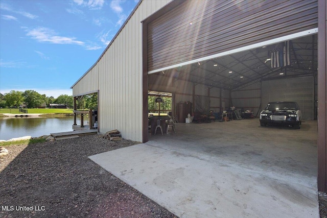 1254 Wade Patrick Rd, Brandon, MS 39042 - garage with a water view, a carport, and concrete driveway