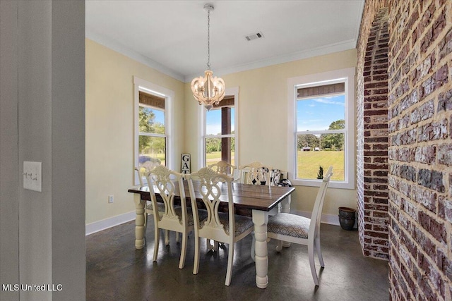 1254 Wade Patrick Rd, Brandon, MS 39042 - dining space featuring a chandelier, baseboards, healthy amount of natural light, ornamental molding, and brick wall